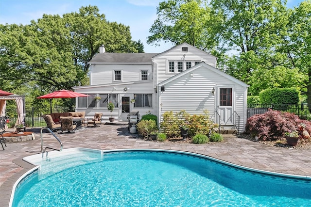70 Willow Ln, New Windsor, NY 12553 - rear view of property featuring outdoor lounge area, fence, a chimney, and a sunroom