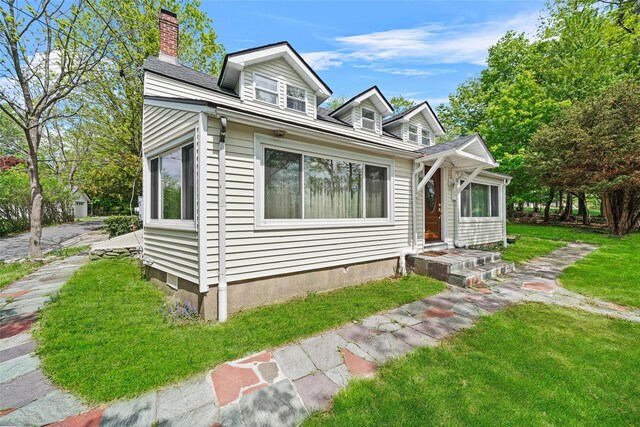 180-184 Pine Tree Rd, Monroe, NY 10950 - bungalow featuring a chimney and a front lawn
