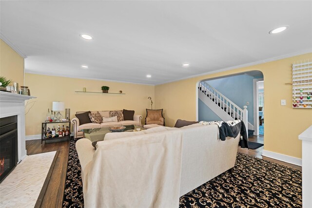 180-184 Pine Tree Rd, Monroe, NY 10950 - living room featuring a fireplace with flush hearth, dark wood-type flooring, arched walkways, stairs, and recessed lighting