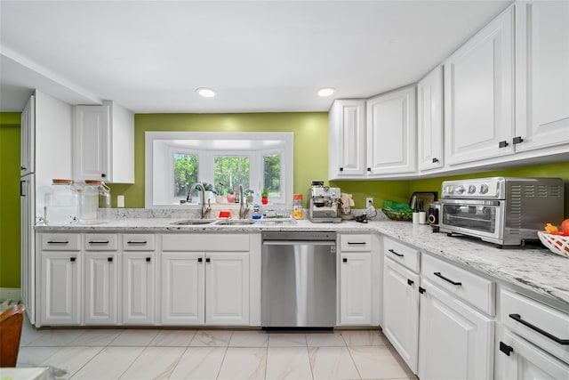 180-184 Pine Tree Rd, Monroe, NY 10950 - kitchen featuring stainless steel dishwasher, a sink, white cabinetry, light marble finish floors, and light stone counters