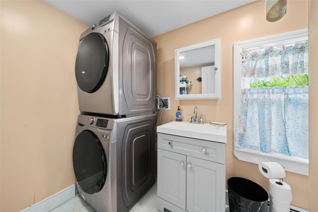 180-184 Pine Tree Rd, Monroe, NY 10950 - washroom with stacked washing machine and dryer, cabinet space, and baseboards