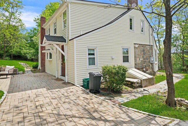 180-184 Pine Tree Rd, Monroe, NY 10950 - rear view of house featuring a chimney and a patio area