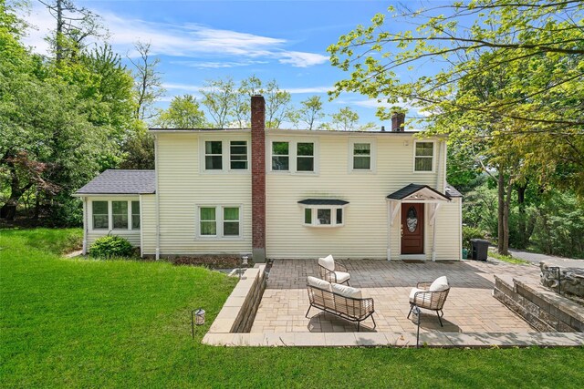 180-184 Pine Tree Rd, Monroe, NY 10950 - back of property with a chimney, a patio area, and a lawn