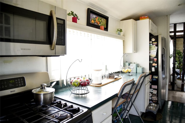 125 Timberline Dr, Brentwood, NY 11717 - kitchen featuring stainless steel appliances and white cabinetry
