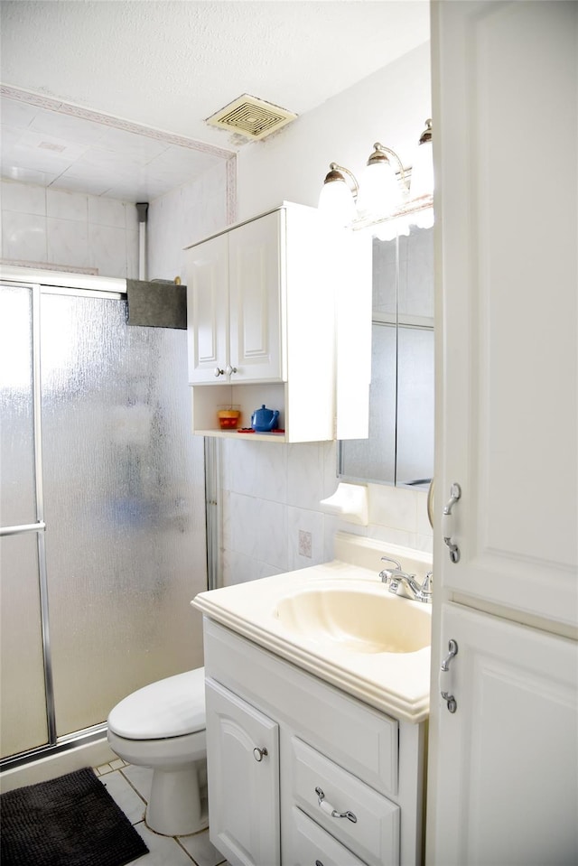 125 Timberline Dr, Brentwood, NY 11717 - bathroom with a stall shower, vanity, toilet, and tile patterned floors