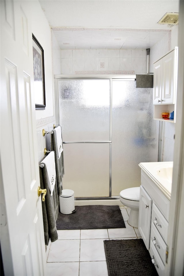 125 Timberline Dr, Brentwood, NY 11717 - full bath with a shower stall, tile patterned flooring, vanity, and toilet