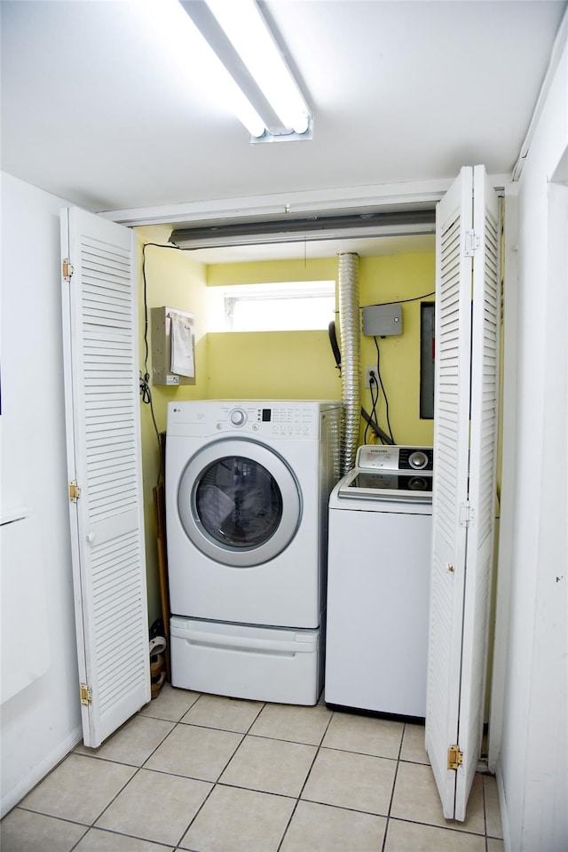 125 Timberline Dr, Brentwood, NY 11717 - washroom featuring independent washer and dryer and light tile patterned floors