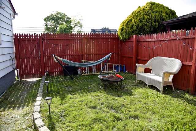 125 Timberline Dr, Brentwood, NY 11717 - view of yard featuring a fire pit