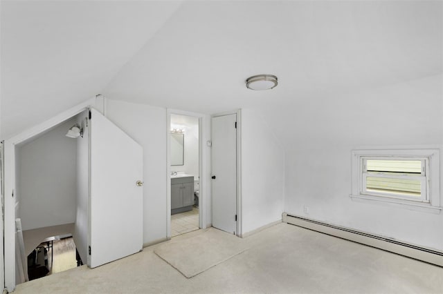 42 Campwoods Rd, Ossining, NY 10562 - additional living space featuring baseboard heating, light carpet, vaulted ceiling, and a sink