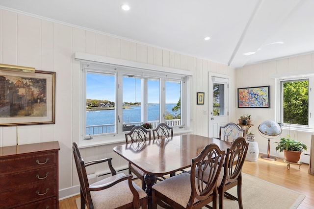47 Rampasture Rd Apt M, Hampton Bays, NY 11946 - dining space with light wood finished floors, a water view, a decorative wall, a baseboard heating unit, and recessed lighting