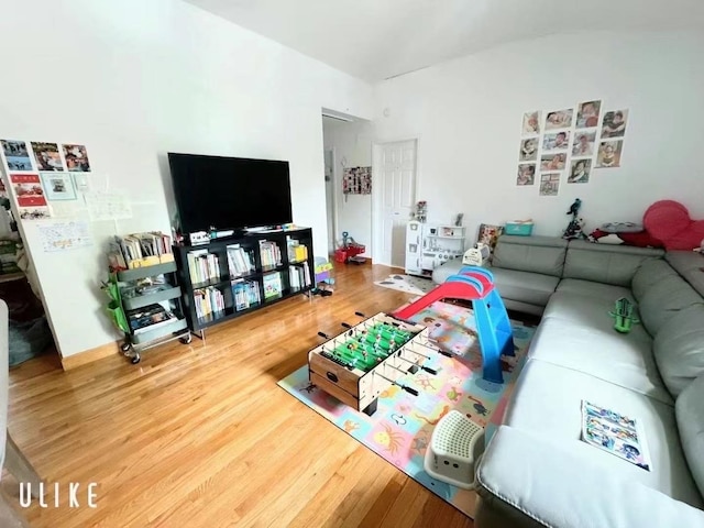 214-27 38th Ave, Bayside, NY 11361 - living area with wood finished floors and vaulted ceiling