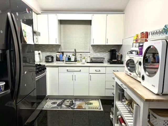 214-27 38th Ave, Bayside, NY 11361 - kitchen featuring a sink, freestanding refrigerator, light countertops, and decorative backsplash
