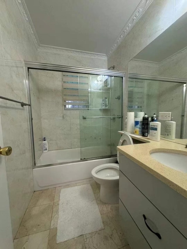 214-27 38th Ave, Bayside, NY 11361 - full bath featuring ornamental molding, bath / shower combo with glass door, toilet, and vanity