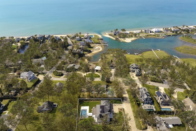 aerial overview of property's location featuring a nearby body of water and nearby suburban area