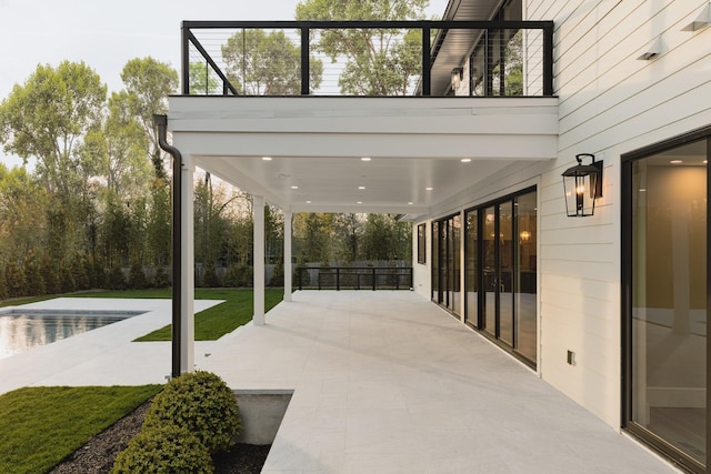 view of patio / terrace with an outdoor pool