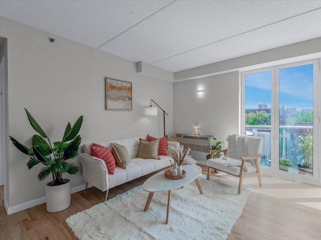88-20 Parsons Blvd Unit 6D, Jamaica, NY 11432 - living room featuring wood finished floors, baseboards, and a view of city