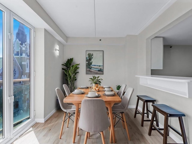 88-20 Parsons Blvd Unit 6D, Jamaica, NY 11432 - dining area with light wood-style floors and baseboards