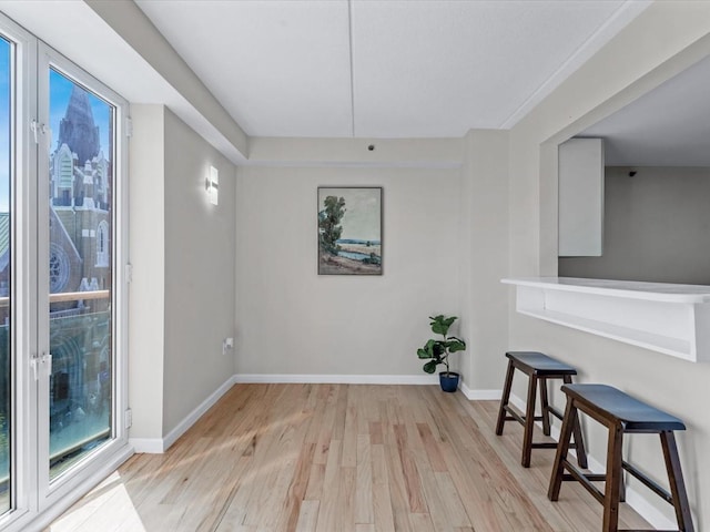 88-20 Parsons Blvd Unit 6D, Jamaica, NY 11432 - unfurnished dining area featuring light wood-style floors and baseboards