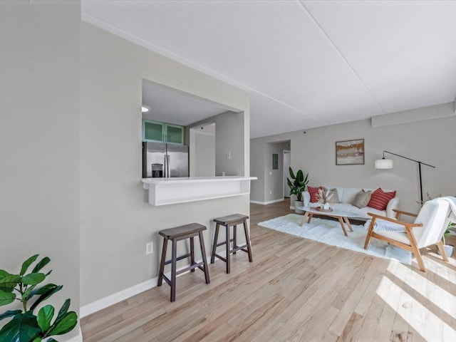 88-20 Parsons Blvd Unit 6D, Jamaica, NY 11432 - living area featuring light wood-style floors and baseboards