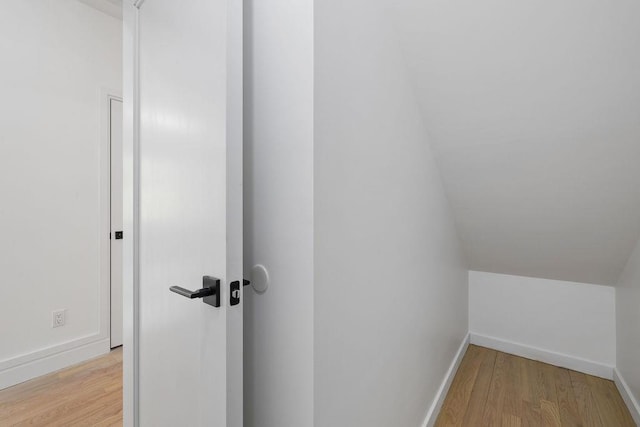 interior space with wood finished floors and baseboards