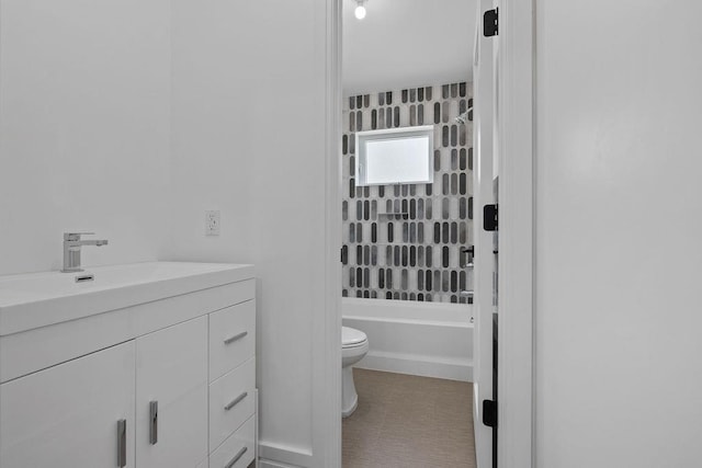 full bathroom featuring toilet, vanity, washtub / shower combination, and tile patterned flooring