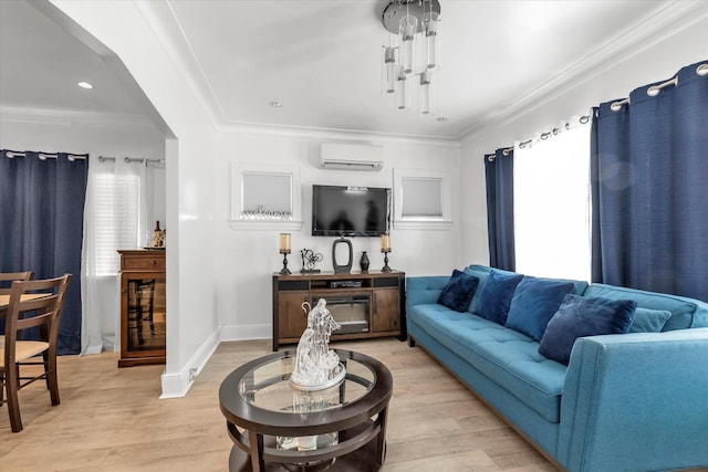 living area featuring a wall mounted AC, light wood finished floors, ornamental molding, baseboards, and recessed lighting