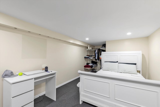 bedroom featuring dark colored carpet, recessed lighting, and baseboards