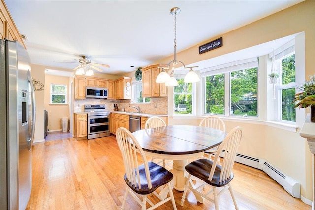 7 Cambridge Cir, Monroe, NY 10950 - dining space featuring light wood finished floors, ceiling fan, a baseboard radiator, and baseboards