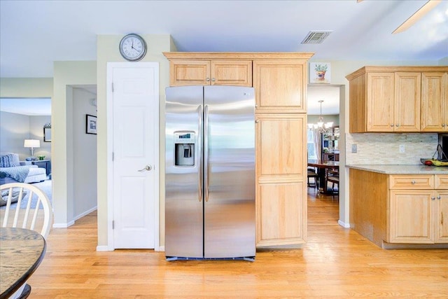 7 Cambridge Cir, Monroe, NY 10950 - kitchen featuring stainless steel fridge, light brown cabinetry, a chandelier, light wood-style floors, and light countertops