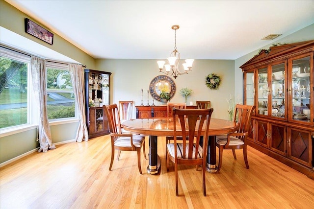 7 Cambridge Cir, Monroe, NY 10950 - dining area featuring light wood-style floors, a chandelier, and baseboards
