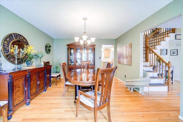 7 Cambridge Cir, Monroe, NY 10950 - dining space with a chandelier, stairs, and light wood-type flooring