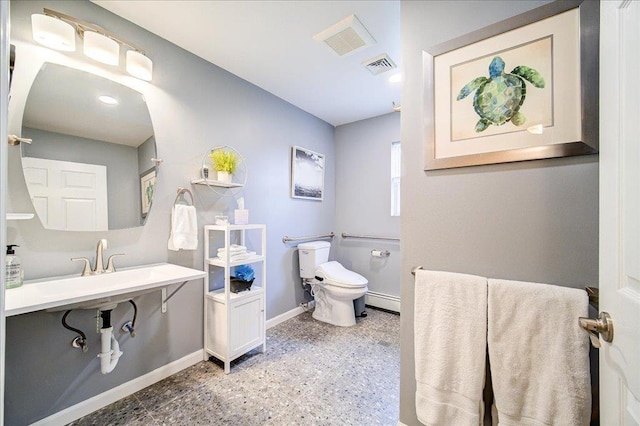 7 Cambridge Cir, Monroe, NY 10950 - half bathroom featuring baseboards, toilet, and a baseboard heating unit