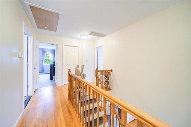 7 Cambridge Cir, Monroe, NY 10950 - hallway with an upstairs landing, attic access, light wood-type flooring, and baseboards