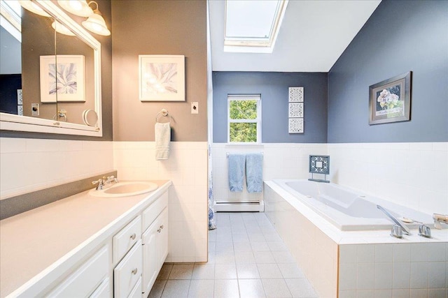 7 Cambridge Cir, Monroe, NY 10950 - bathroom with a baseboard radiator, a skylight, tile walls, vanity, and a bath