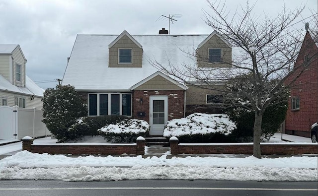158-38 84th St, Howard Beach, NY 11414 - cape cod house featuring fence, brick siding, and a chimney