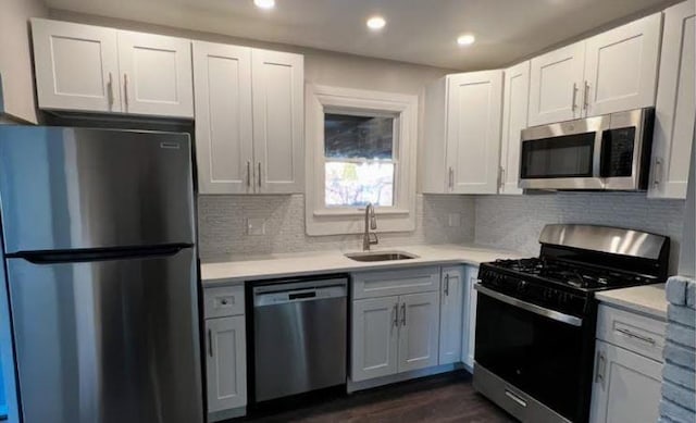158-38 84th St, Howard Beach, NY 11414 - kitchen featuring appliances with stainless steel finishes, a sink, light countertops, and recessed lighting