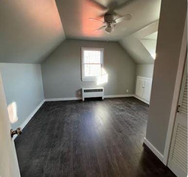 158-38 84th St, Howard Beach, NY 11414 - additional living space featuring radiator heating unit, ceiling fan, wood finished floors, vaulted ceiling, and baseboards