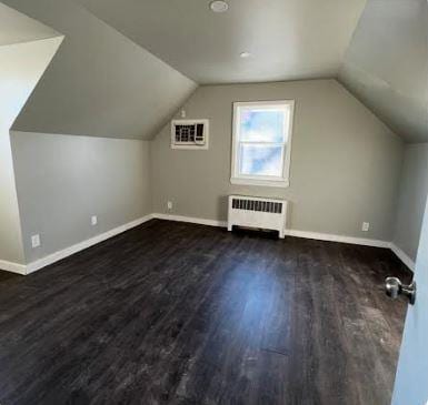 158-38 84th St, Howard Beach, NY 11414 - bonus room featuring radiator, a wall unit AC, baseboards, wood finished floors, and lofted ceiling