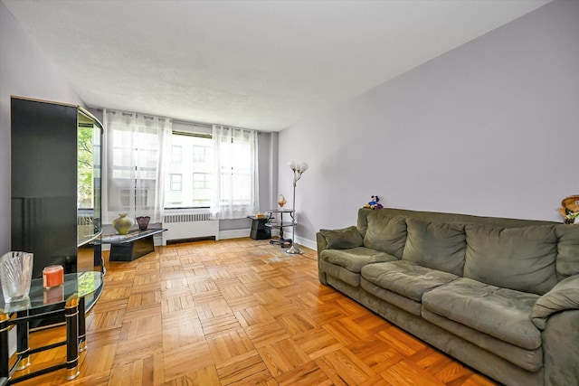 98-51 64th Ave Unit 2C, Rego Park, NY 11374 - living area featuring radiator and baseboards