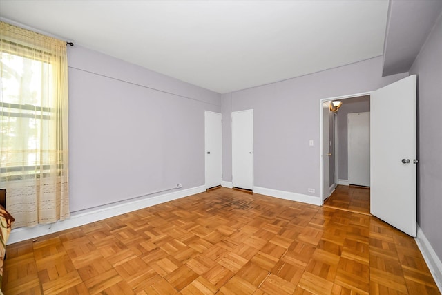 98-51 64th Ave Unit 2C, Rego Park, NY 11374 - unfurnished bedroom with baseboards