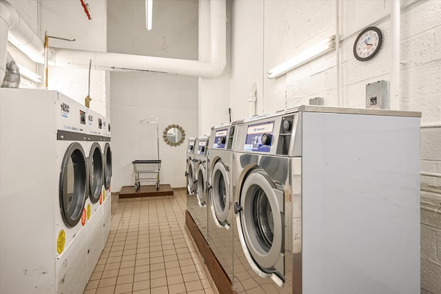 98-51 64th Ave Unit 2C, Rego Park, NY 11374 - shared laundry room featuring independent washer and dryer and tile patterned flooring