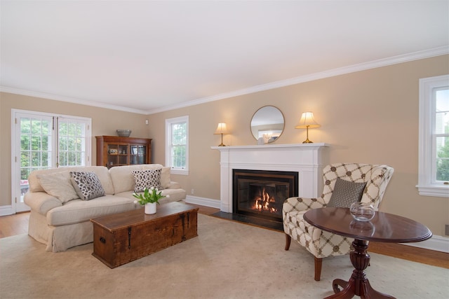953 Peace St, Pelham, NY 10803 - living area with a fireplace with flush hearth, crown molding, wood finished floors, plenty of natural light, and baseboards