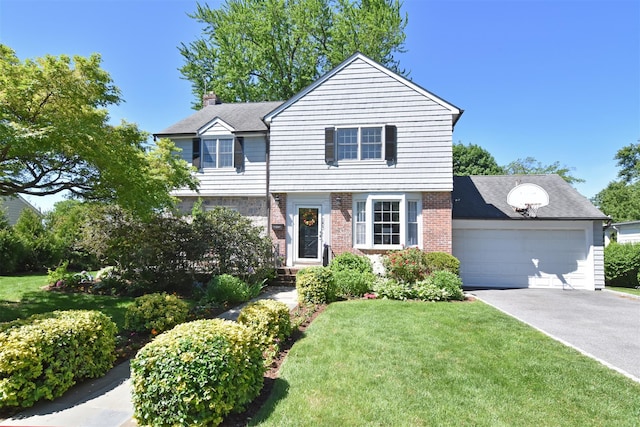 953 Peace St, Pelham, NY 10803 - view of front facade with driveway, brick siding, an attached garage, a front yard, and a chimney