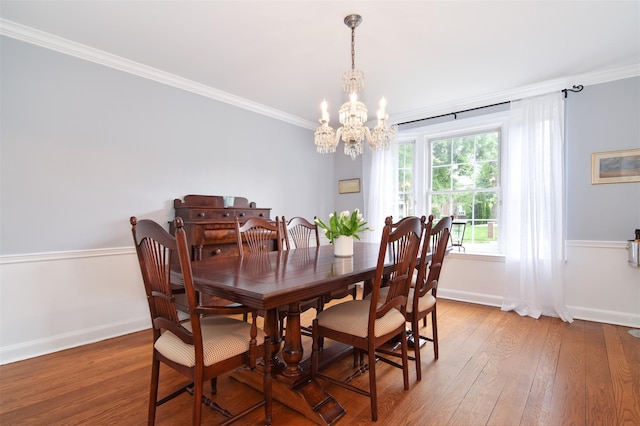953 Peace St, Pelham, NY 10803 - dining space featuring baseboards, light wood-type flooring, a chandelier, and ornamental molding