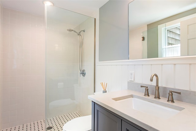 493 Water Mill Towd Rd, Southampton, NY 11968 - full bathroom featuring a walk in shower, toilet, vanity, and wainscoting