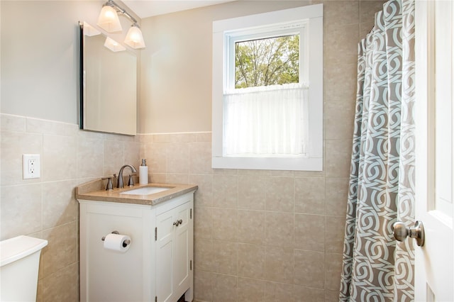 493 Water Mill Towd Rd, Southampton, NY 11968 - bathroom featuring tiled shower, vanity, toilet, and tile walls