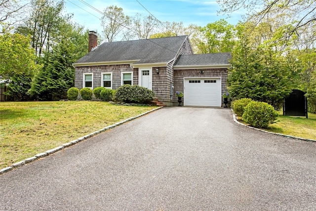 493 Water Mill Towd Rd, Southampton, NY 11968 - shingle-style home with an attached garage, a chimney, a front lawn, and a shingled roof