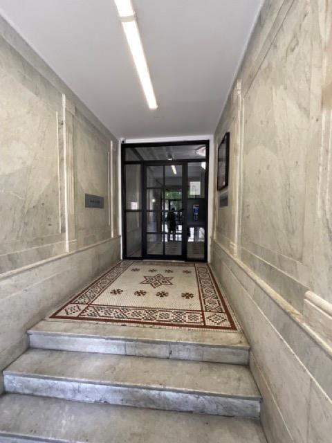 staircase with concrete floors