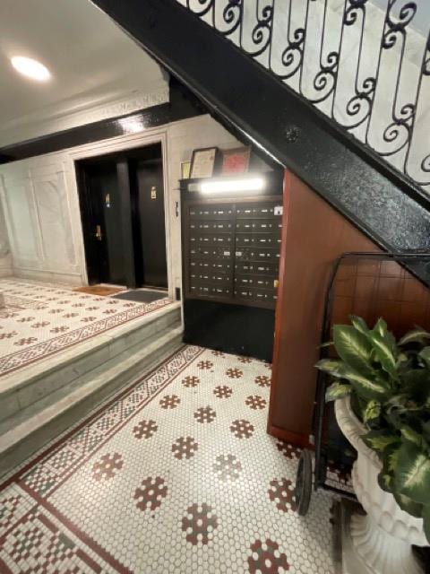 building lobby featuring crown molding