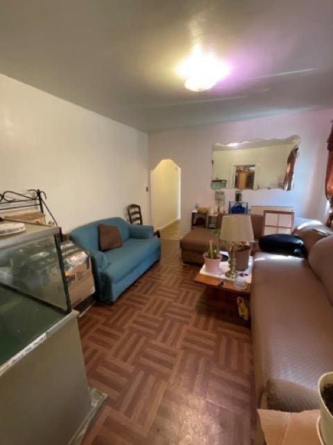 living area featuring arched walkways